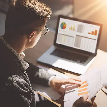 man looking at analytics on screen