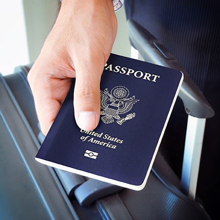 Business man holding passport